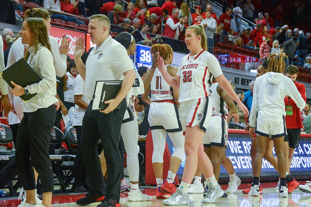 The NC State women's basketball team celebrates after their game against Mount St. Mary's on Sunday, Nov. 13, 2022 in Reynolds Coliseum. NC State beat Mount St. Mary's 86-38.