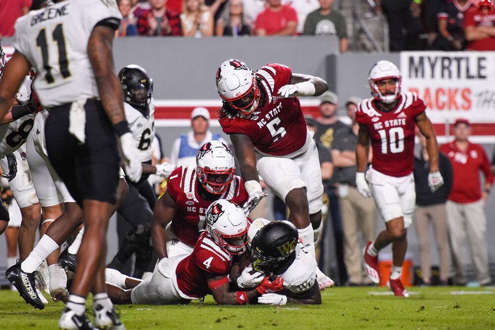 Graduate student safety Cyrus Fagan tackles a Wake Forest player during the game against the Demon Deacons on Saturday, Nov. 5, 2022 at Carter-Finley Stadium.&#160;The Wolfpack beat the Demon Deacons 30-21.
