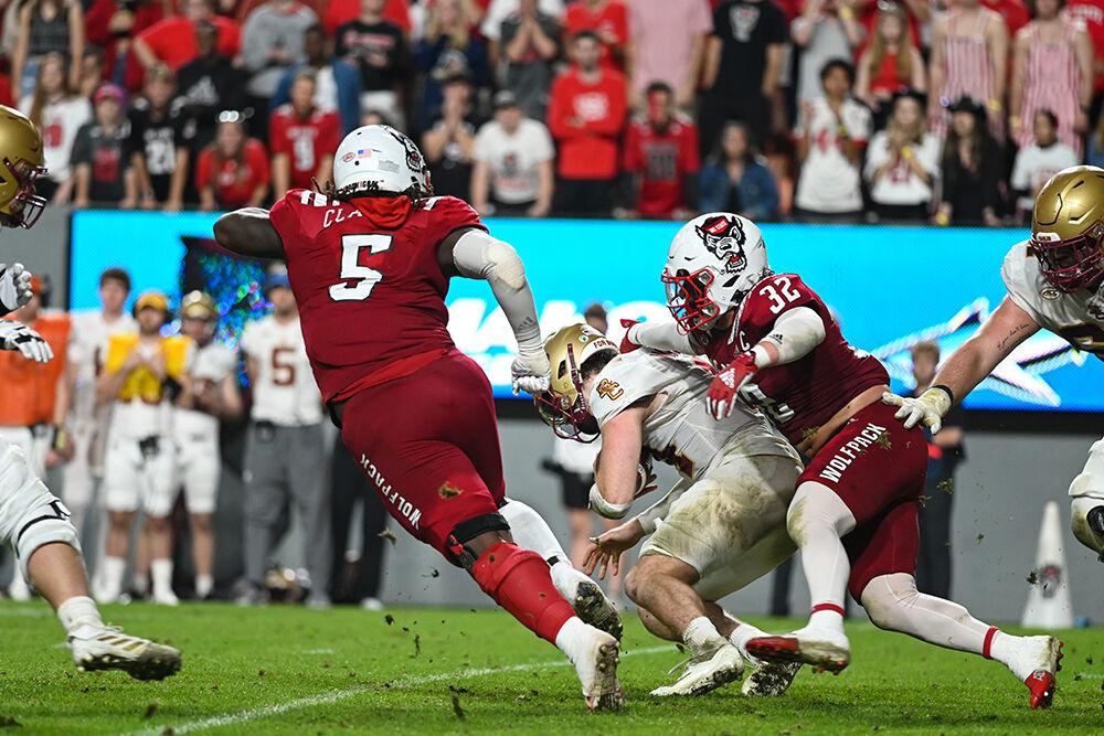 Junior linebacker Drake Thomas sacks the Boston College quarterback during the game on Saturday, Nov. 12, 2022 at Carter-Finley Stadium. Thomas had six tackles and two sacks during the game. NC State lost to Boston College 21-20.