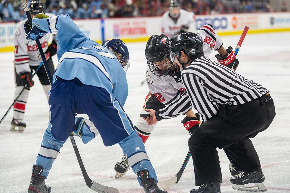 Sophomore forward Emery Oiver attempts to steal the puck during a penalty during the Governor's Cup game against the UNC Tar Heels on Monday, Nov. 21, 2022&#160;in PNC Arena. The Icepack lost to the Tar Heels 4-2.