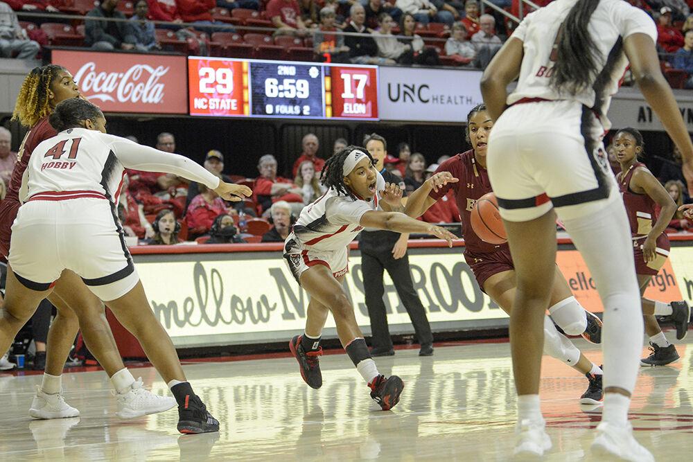 Sophomore guard Aziaha James lunges for the ball during the game against Elon at Reynolds Coliseum on Thursday, Nov. 10, 2022. James had six rebounds and three assists for the Wolfpack. NC State beat Elon 89-55.