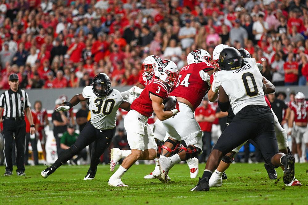 Junior running back Jordan Houston rushes against the Wake Forest Defense on Saturday, Nov. 5, 2022 at Carter Finley Stadium. Houston had 57 rushing yards throughout the game.&#160;NC State defeated Wake Forest 30-21.