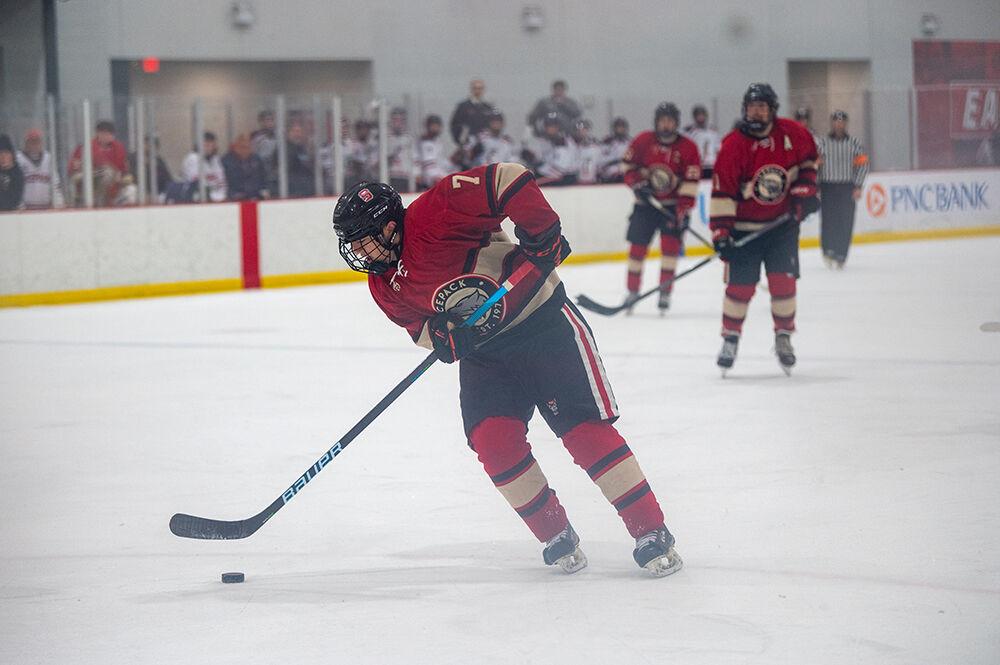 Sophomore forward Zack Robinson carries the puck towards the opposing goal during the gme against Cincinnati Bearcats at Wake Competition Center on Saturday, Nov. 19, 2022. The Icepack beat the Bearcats 4-3.
