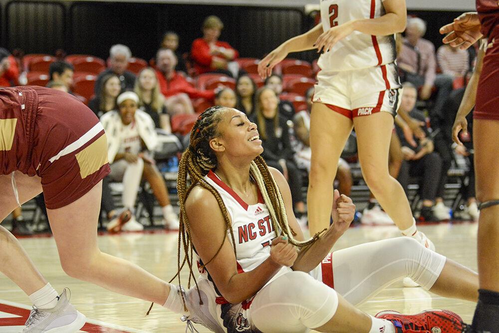 Senior wing Jakia Brown-Turner smiles on the ground during the game against Elon at Reynolds Coliseum on Thursday, Nov. 10, 2022. Brown-Turner scored 10 points for the Wolfpack. NC State beat Elon 89-55.