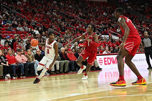 Sophomore guard Terquavion Smith dribbles the ball up the court during the game against Louisville at PNC Arena on Thursday, Dec. 22, 2022. Smith made one field goal and two free throws. The Wolfpack beat the Cardinals 76-64.