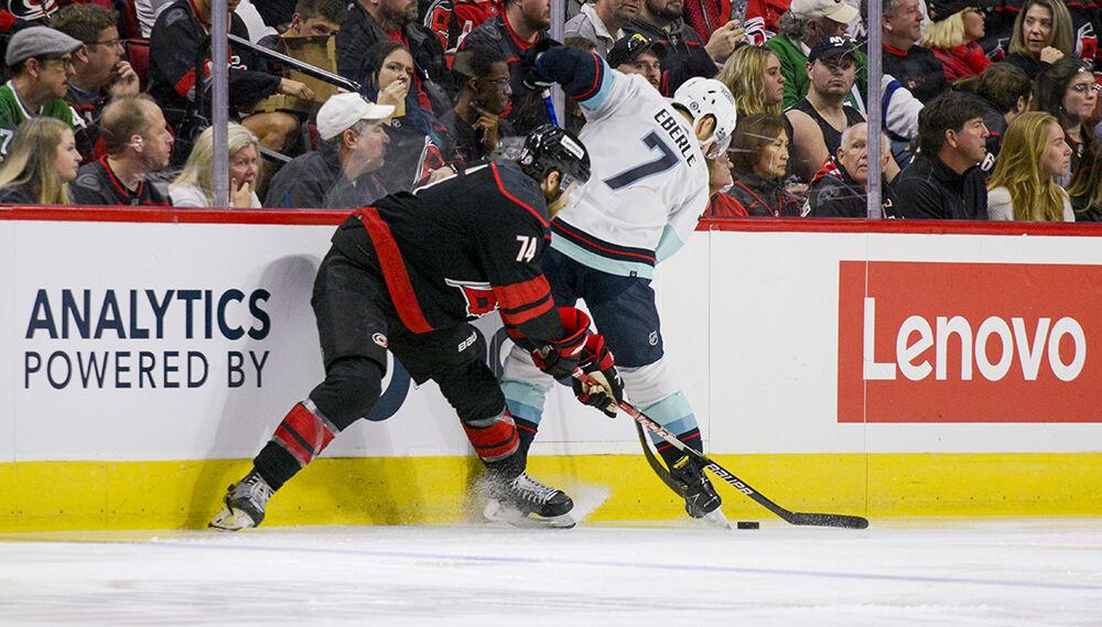 Carolina Hurricanes defenseman Jacob Slavin fights for the puck during the game against Seattle Kraken on Sunday, March 6, 2022 in PNC Arena. Slavin had one shot throughout the game. The Hurricanes beat the Kraken 3-2.