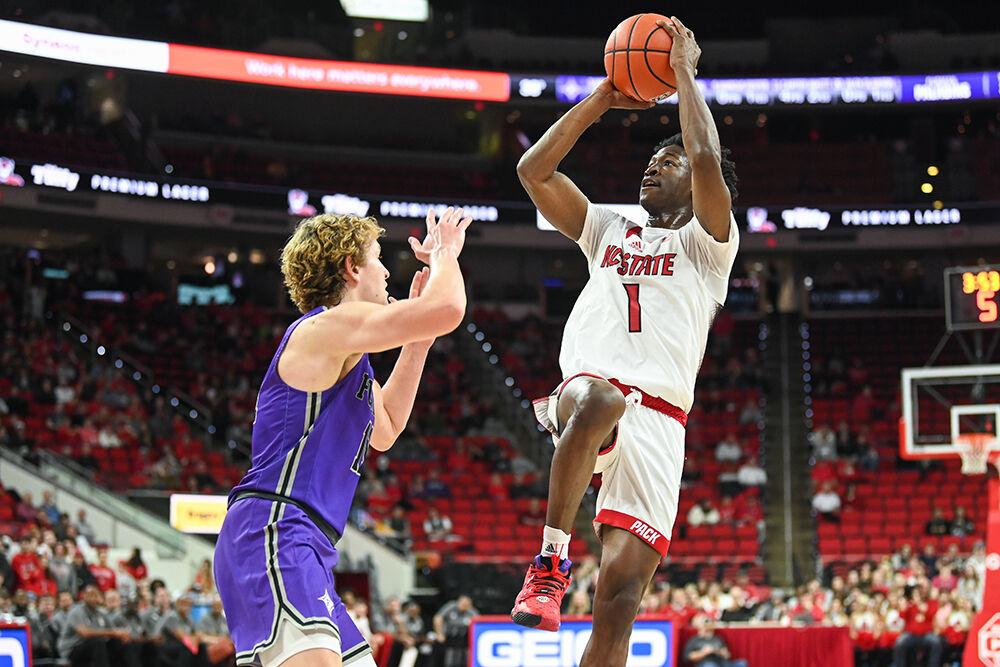 Graduate guard Jarkel Joiner shoots the ball during the game against Furman in PNC Arena on Tuesday, Dec. 13, 2022. Joiner scored 10 points and made five assists for the Wolfpack. NC State beat Furman 92-73.
