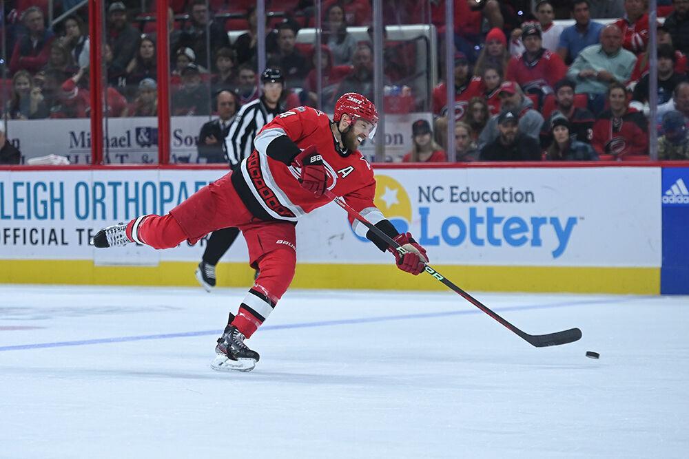 Defenseman Jaccob Slavin passes the puck up the ice during the Hurricanes' home game against the Edmonton Oilers on Thursday, Nov. 10, 2022 in PNC Arena. Slavin had one assist for one point as the Canes beat the Oilers 7-2.