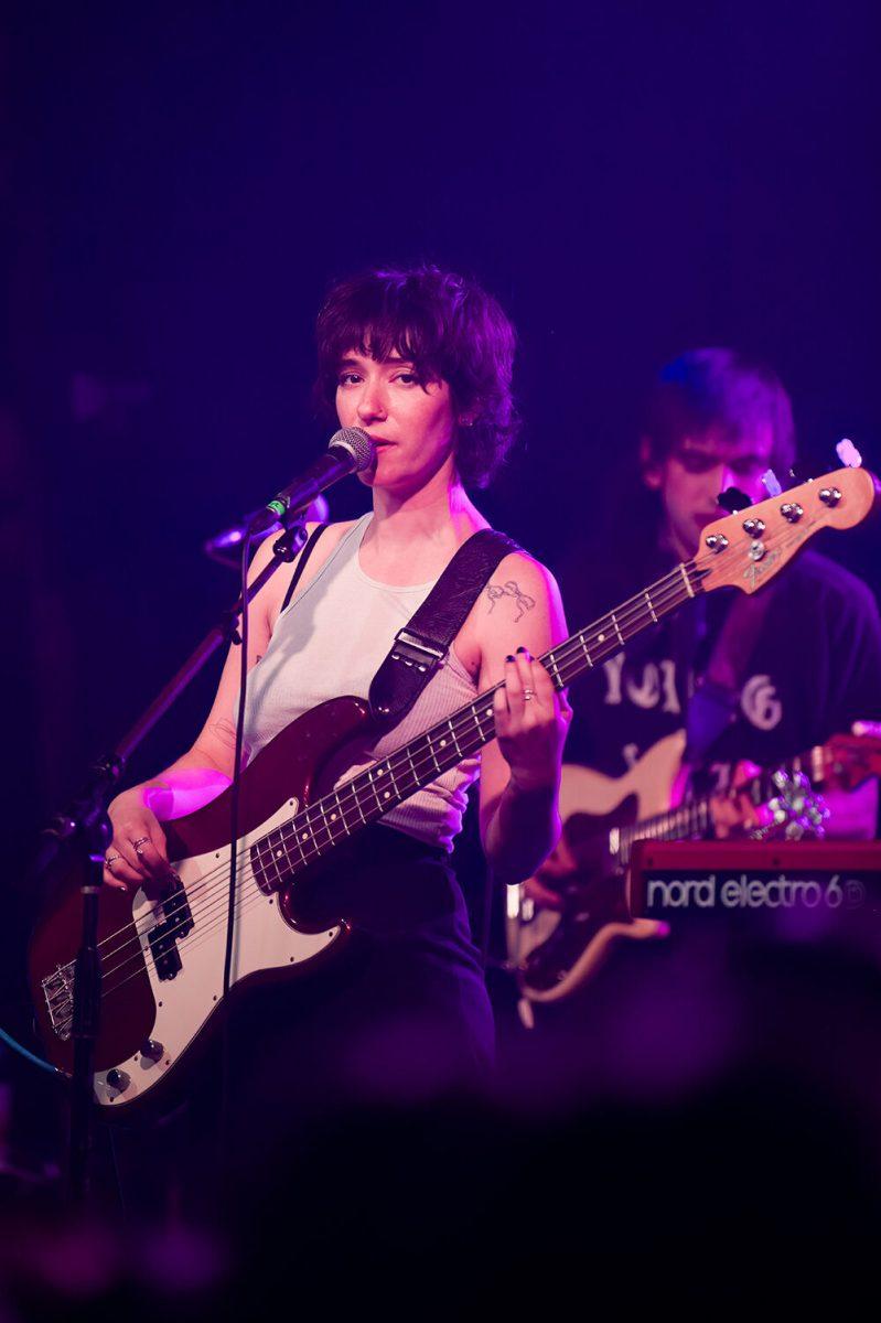 Mina Walker of Daisy the Great sings and plays bass during their opener for The Happy Fits' concert at Cats Cradle on Tuesday Dec. 13, 2022. Daisy the Great has released two albums since 2016.