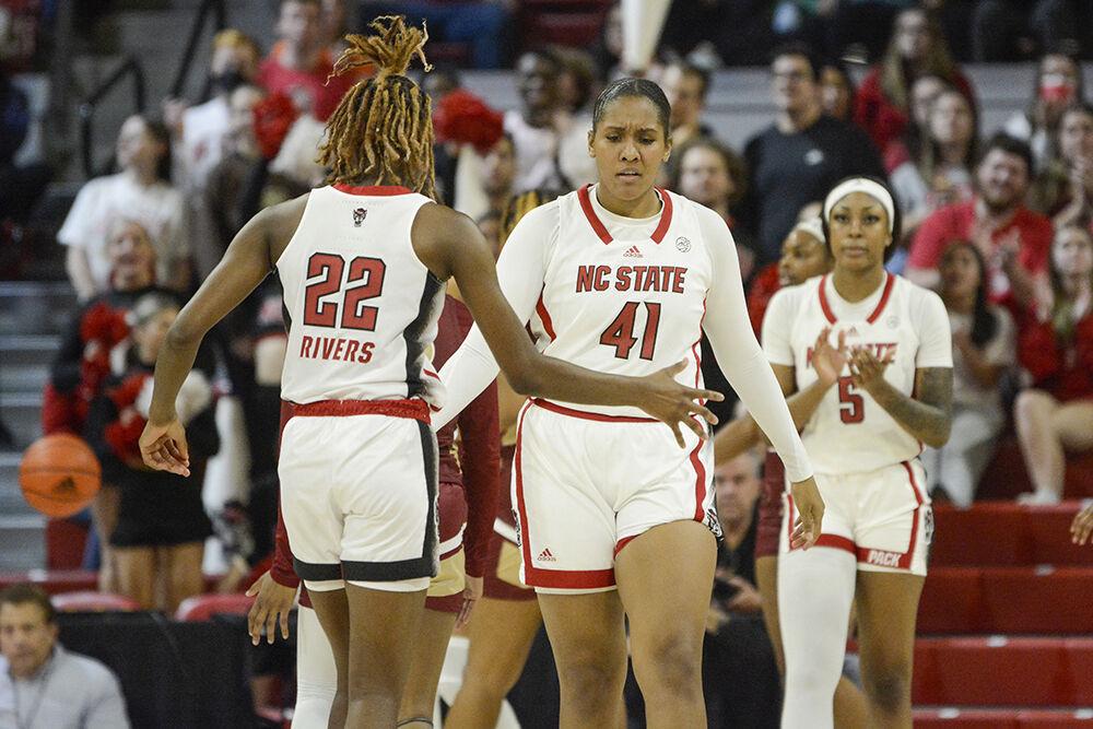 Sophomore guard Saniya Rivers (left) and senior center Camille Hobby celebrate during the game against Elon at Reynolds Coliseum on Thursday, Nov. 10, 2022. Rivers led the team in rebounds with seven and Hobby had 16 points for the Wolfpack. NC State beat Elon 89-55.