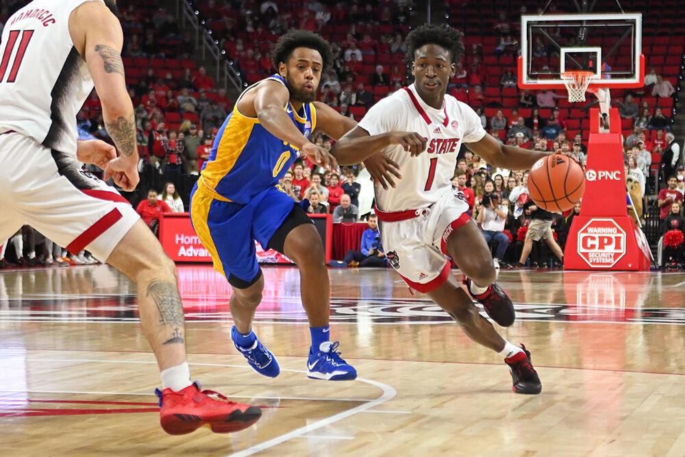Graduate guard Jarkel Joiner speeds down the court in the game against Pitt inside PNC Arena on Friday, Dec. 2, 2022. Joiner made six rebounds, two assists, and one steal during the game. The Wolfpack suffered a defeat to the Panthers 68-60.