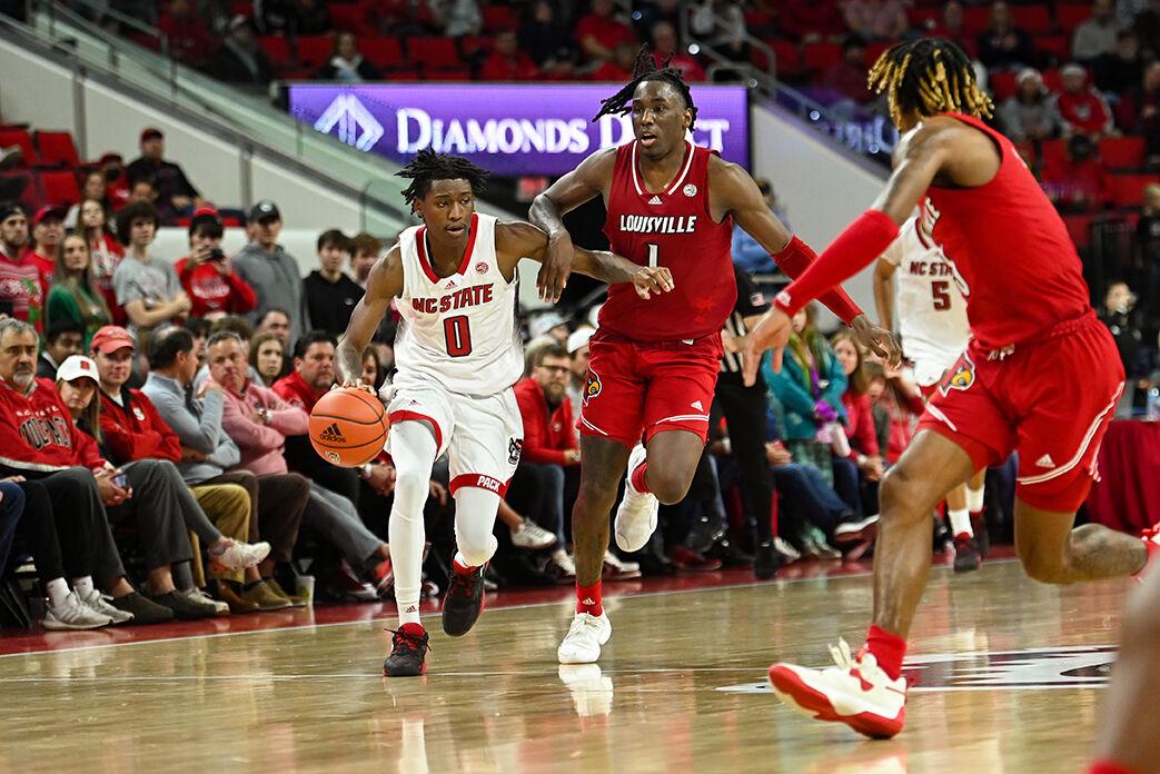 Sophomore guard Terquavion Smith dribbles the ball up the court during the game against Louisville at PNC Arena on Thursday, Dec. 22, 2022. Smith made one field goal and two free throws. The Wolfpack beat the Cardinals 76-64.