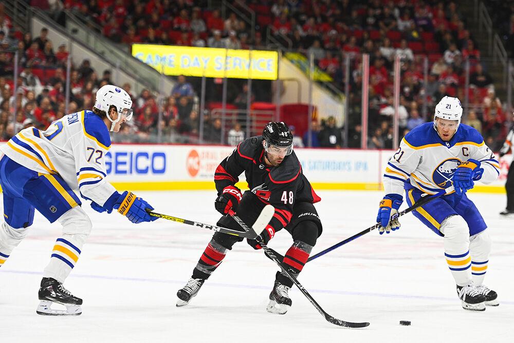 Carolina Hurricanes left wing Jordan Martinook chases after the puck alongside Buffalo Sabre opponents during the game on Friday, Nov. 4, 2022 in PNC Arena. The Hurricanes beat the Sabres 5-3.