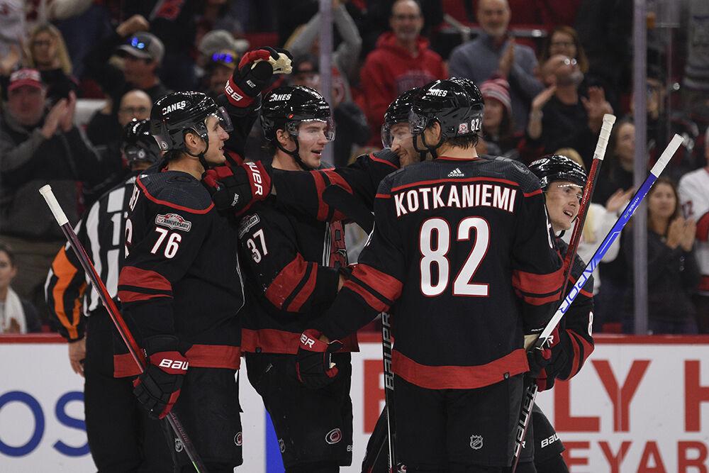Carolina Hurricanes players celebrate center Martin Necas' goal in the game against the New York Islanders in PNC Arena on Friday, Oct. 28, 2022. Necas made one goal and had two shots. Hurricanes lost 6-2.