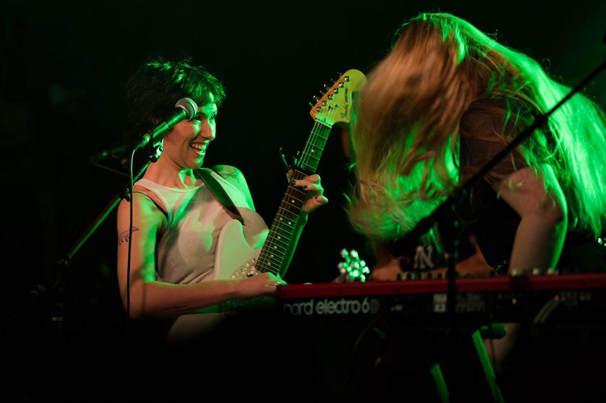Mina Walker and Kelly Dugan of Daisy the Great dance while playing "Cry in the Mirror" during their opener for The Happy Fits' concert at Cats Cradle on Tuesday Dec. 13, 2022. Daisy the Great has released two albums since 2016.