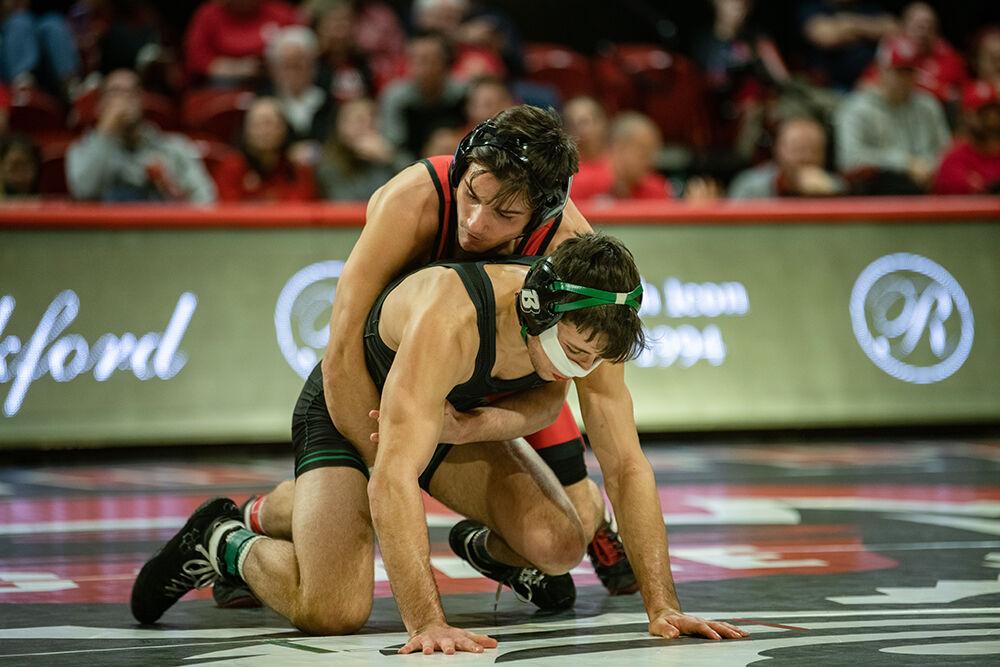 Sophomore Ryan Jack holds onto his opponent during the duel against Binghampton at Reynolds Coliseum on Friday Jan. 6, 2023. Jack defeated his opponent 12-2. NC State beat Binghampton 36-3.
