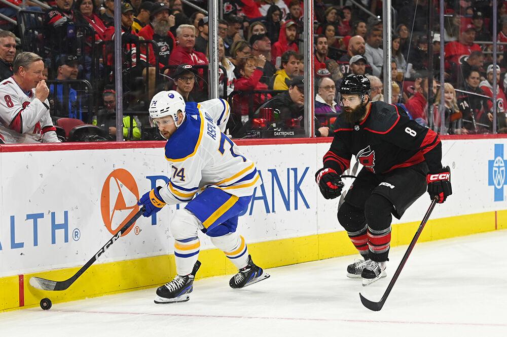 Carolina Hurricanes defenseman Brent Burns defends Buffalo Sabre opponent during the game on Friday, Nov. 4, 2022 in PNC Arena. The Hurricanes beat the Sabres 5-3.