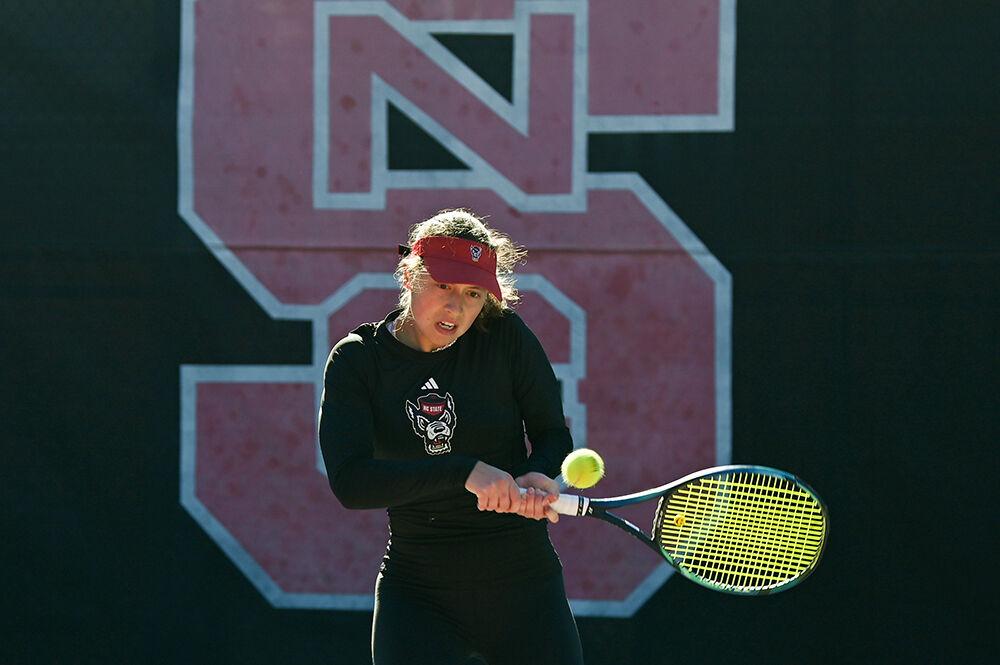 Freshman Anna Zyryanova makes a forehand swing in her doubles match against Illinois at the Dail Outdoor Tennis Stadium on Saturday, Jan. 28, 2023. Zyranova won both her doubles match and her singles match. The Wolfpack pulled a win over the Fighting Illini 4-0.