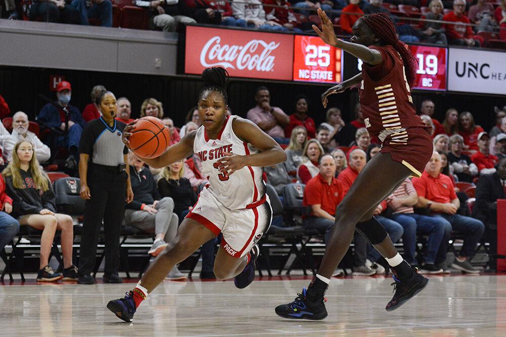 Junior guard Diamond Johnson charges past an opponent at the game against Boston College in Reynolds Coliseum on Thursday, Jan. 5, 2023. Johnson scored 18 points and the Wolfpack lost to the Eagles 79-71.