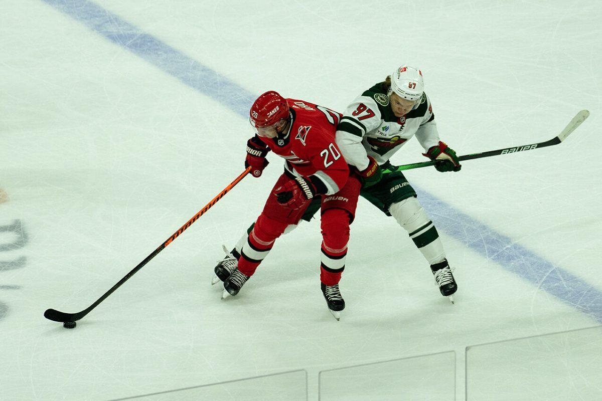 Center Sebastian Aho fights for control of puck during the gave versus Minnesota at PNC Arena on Thursday, Jan. 19, 2023. Aho made three shots on goal. The Hurricanes beat the Wild 5-2.