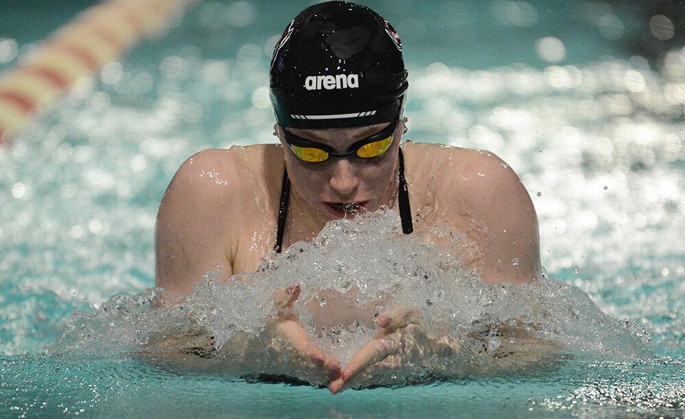 Freshman Aubree Brouwer comes up for air in the women's 100-yard breaststroke during the NC State Wolfpack's swimming and diving meet against the North Carolina Tar Heels and Virginia Cavaliers. Brouwer placed fifth with a 1:02.17. The Wolfpack women beat the Tar Heels 243-110 and lost to the Cavaliers 130-223.