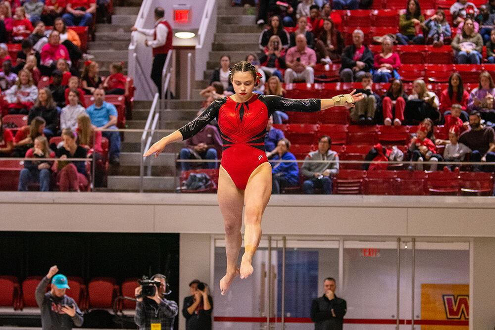 Senior Chloe Negrete performs on the balance beam during the gymnastics meet against Pitt and George Washington at Reynolds Coliseum on Saturday, Jan. 21, 2023. NC State beat Pitt and George Washington with an overall score of 196.650.