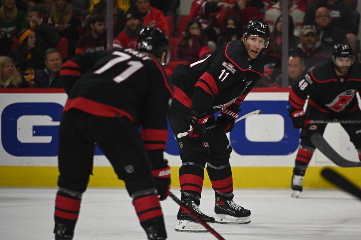 Carolina Hurricanes center Jordan Staal shouts to right wing Jesper Fast before a face-off during the game against the Boston Bruins in PNC Arena on Sunday, Jan. 29, 2023. Staal had one goal during the game. The Hurricanes beat the Bruins 4-1.