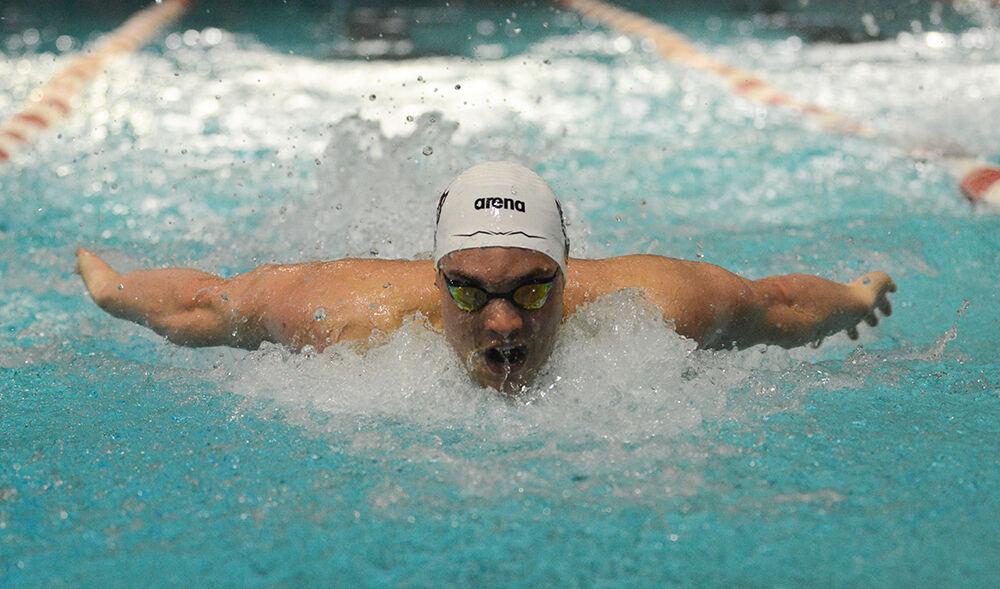 Senior Nyls Korstanje comes up for air in the men's 100 yard butterfly during the NC State Wolfpack's swimming and diving meet against the North Carolina Tar Heels and Virginia Cavaliers. Korstanje placed first with a 46.31. The Wolfpack men beat the Cavaliers 264-89 and the Tar Heels 285-68.