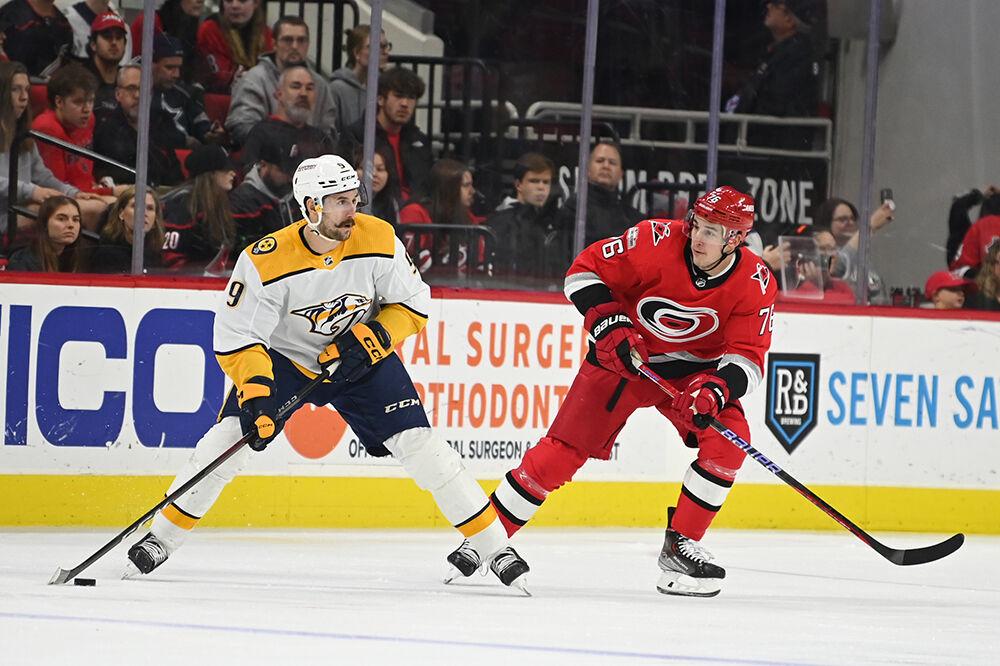 Carolina Defenseman Brady Skjei defends Nashville Predator opponent during the game in PNC Arena on Thursday, Jan. 5, 2023. The Carolina Hurricanes lost 5-3.