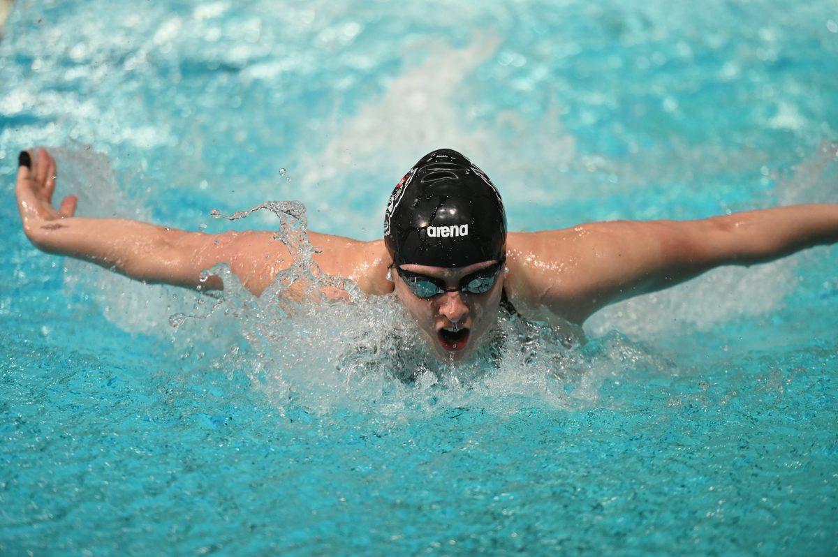 Sophomore Caroline Sheble surfaces for a breath in the women's 200 yard individual medley during the NC State Wolfpack's swim and dive meet against the UNC-Wilmington Seahawks at the Willis R. Casey Aquatics Center on Friday, Jan. 27, 2023. The Wolfpack women beat the Seahawks 186-105.