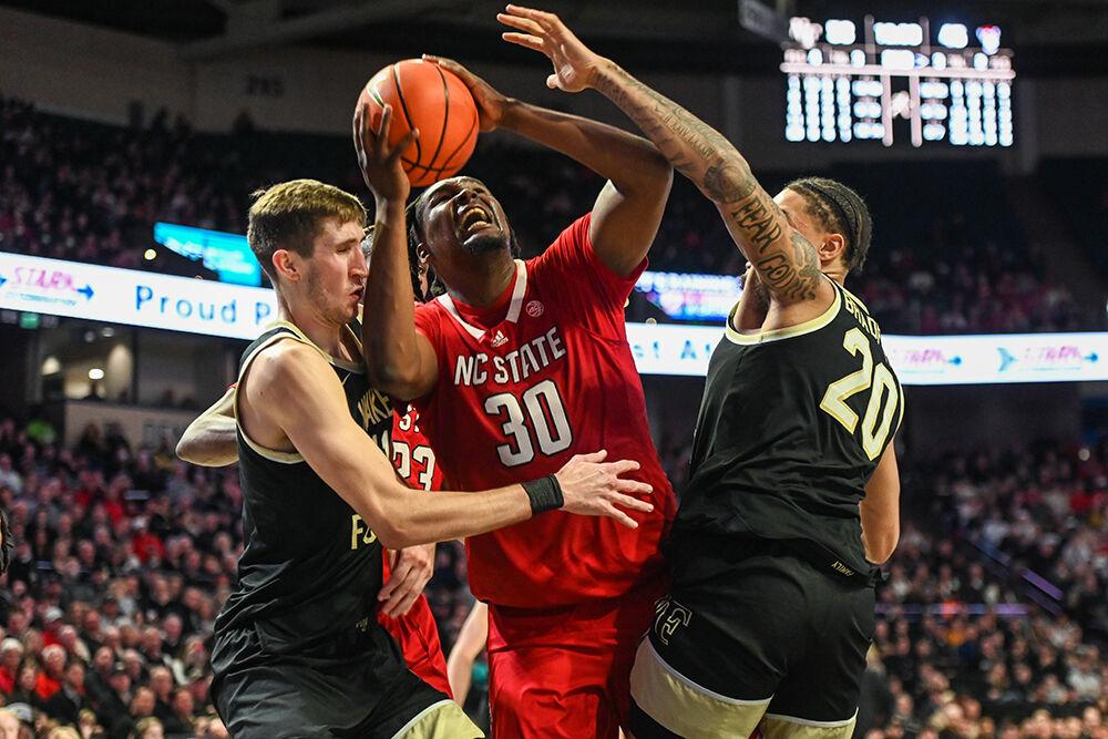 Graduate forward DJ Burns shoots the ball through the block during the game against Wake Forest in Lawrence Joel Veterans Memorial Coliseum on Saturday, Jan. 28, 2023. Burns led in scoring with a career-high 31 points and made nine rebounds for the Wolfpack. NC State beat Wake Forest 79-77.