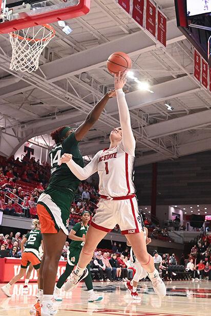 Graduate center River Baldwin shoots at the goal versus Miami in Reynolds Coliseum on Thursday, Jan. 19, 2023. Baldwin scored six points in the game against Miami. NC State won 71-61.