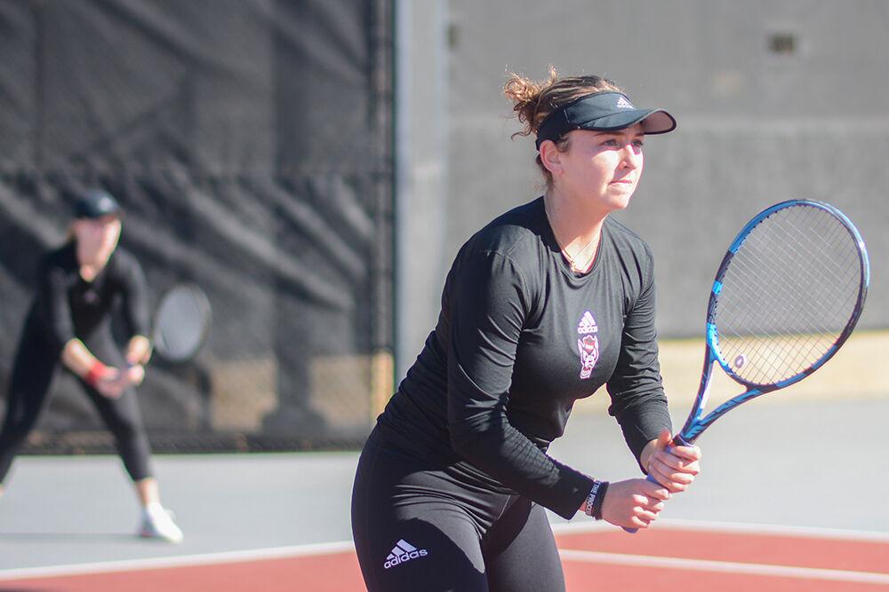 Junior Abigail Rencheli prepares for the serve in her doubles match against Illinois at the Dail Outdoor Tennis Stadium on Saturday, Jan. 28, 2023. Rencheli lost her doubles match, but her singles match went unfinished.&#160;The Wolfpack won the match 4-0.