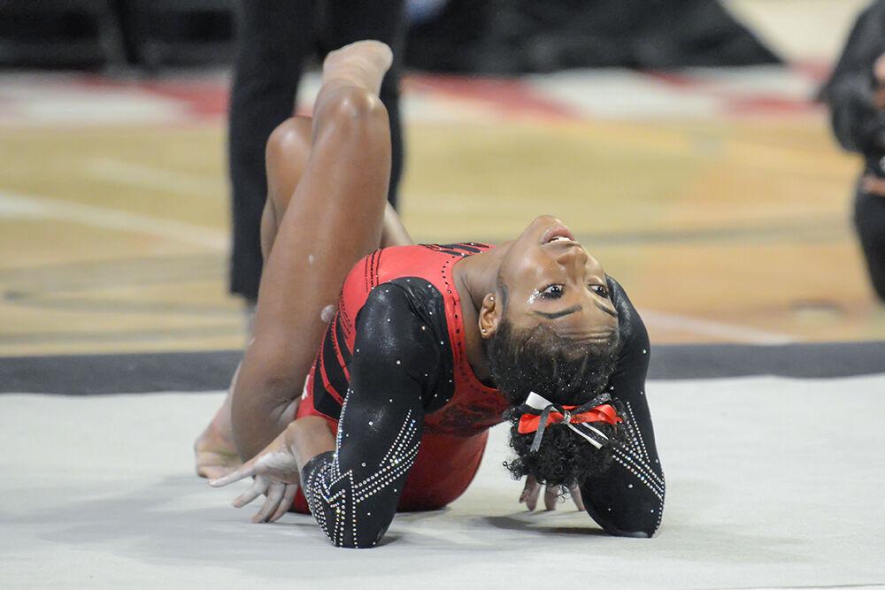Junior gymnast Madison Benson poses during her floor routine in the meet against Pitt and George Washington University at Reynolds Coliseum on Saturday, Jan. 21, 2023. Benson scored a 9.775 on her routine. NC State beat Pitt and George Washington with an overall score of 196.650.