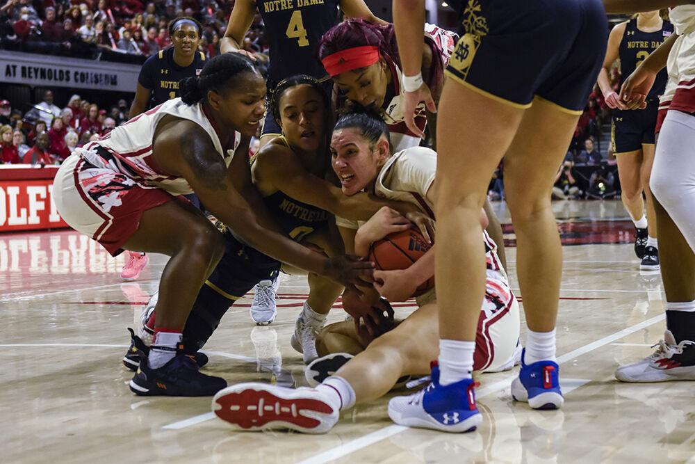 Graduate forward Mimi Collins fights for the ball during the game versus Notre Dame at Reynolds Coliseum on Sunday, Jan. 29, 2023. Collins made six field goals. The Wolfpack beat the Fighting Irish 65-69.