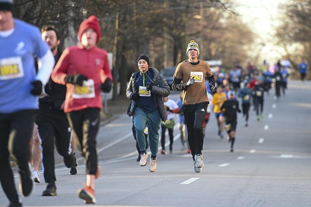 Rafael Hagenhofer and Hank Tucker runs during the Krispy Kreme Challenge in Raleigh, NC on Saturday, Feb. 4, 2023. Since the event started in 2004, all proceeds raised were donated to the UNC Children's Hospital.