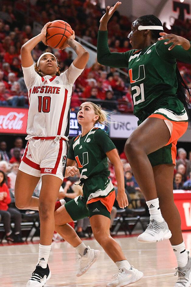 Sophomore guard Aziaha James shoots at the goal versus Miami in Reynolds Coliseum on Thursday, Jan. 19, 2023. James scored 10 points in the game against Miami. NC State won 71-61.