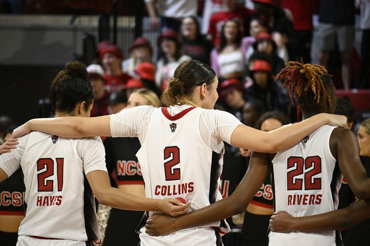 The NC State women's basketball team gathers after the game against Miami in Reynolds Coliseum on Thursday, Jan. 19, 2023. NC State beat Miami 71-61.