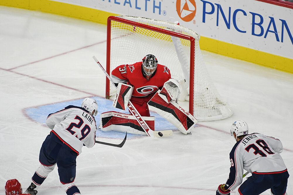 Carolina Hurricanes goalie Frederik Andersen blocks a shot with his stick during the game against the Columbus Blue Jackets on Wednesday, Oct. 12, 2022 in PNC Arena. Andersen had a save percentage of .969 only allowing one goal throughout the night. The Hurricanes beat the Blue Jackets 4-1.