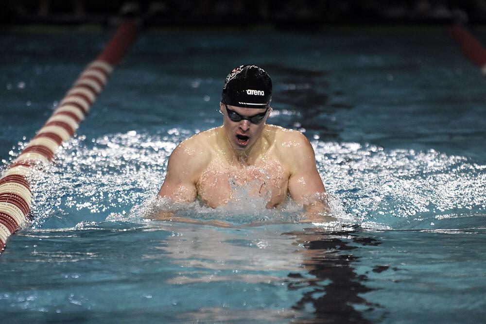 Junior Mikey Moore comes up for air in the men's 200-yard individual medley during the NC State Wolfpack's swimming and diving meet against the UNC-Wilmington Seahawks at the Willis R. Casey Aquatic Center on Friday, Jan. 27, 2023. Moore placed first in the heat with a 1:46.33. The Wolfpack men beat the Seahawks 160-126.