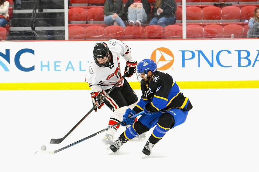 Senior forward Matt Miller fights for the puck in the game against the University of Delaware on Saturday, Jan. 14, 2023 at Wake Competition Center. The Icepack won against the Hens 3-2.
