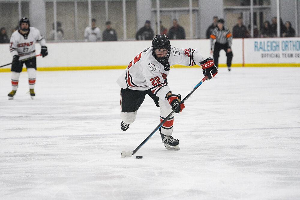Sophomore forward Emery Oliver carries the puck in a game against University of Delaware on Friday, Jan. 13, 2023 at Wake Competition Center. The Icepack won against the Hens 7-3.