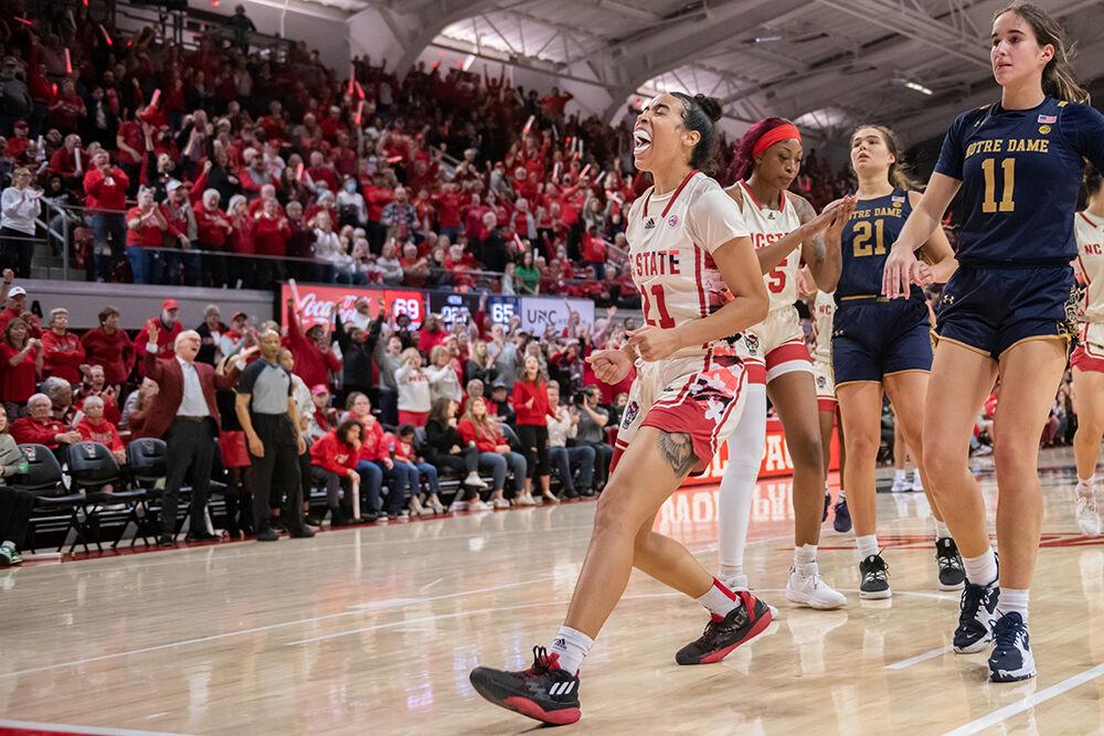 Junior guard Madison Hayes celebrates after scoring during the game versus Notre Dame at Reynolds Coliseum on Sunday, Jan. 29, 2023. Hayes made two field goals and two free throws. The Wolfpack beat the Fighting Irish 65-69.
