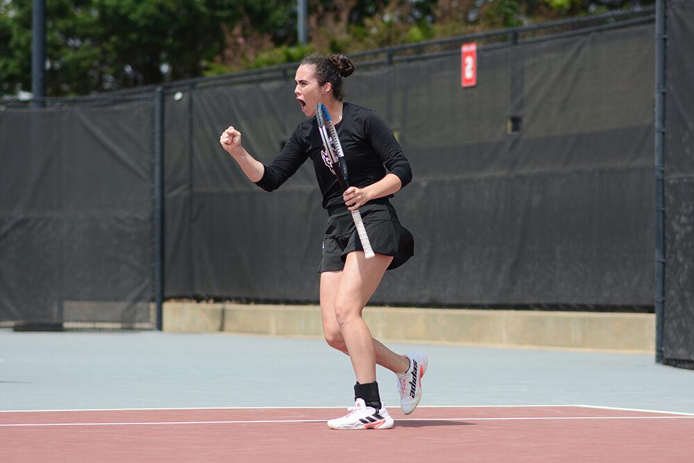 Senior Nell Miller shouts as she celebrates a set during her doubles match against Notre Dame on Saturday, April 16, 2022 at Dail Outdoor Tennis Stadium. The Wolfpack won 7-0.