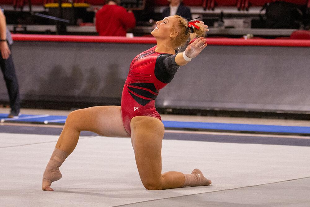 Junior Krista Zultevicz poses for the judges during the floor event of the gymnastics meet against Pitt and George Washington at Reynolds Coliseum on Saturday, Jan. 21, 2023. NC State beat Pitt and George Washington with an overall score of 196.650.