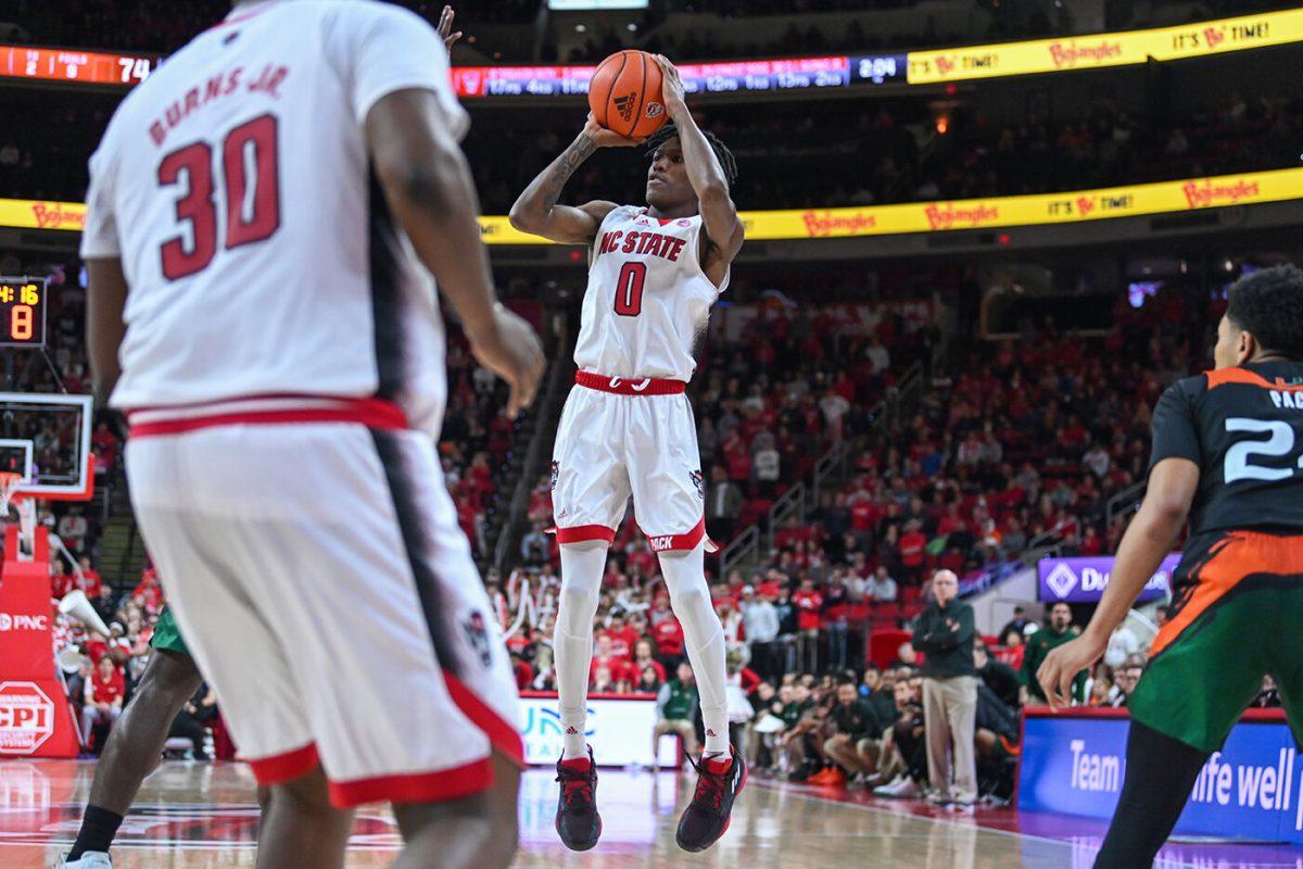 Sophomore guard Terquavion Smith shoots the ball during the game against Miami in PNC Arena on Saturday, Jan. 14, 2023. Smith led NC State in scoring with 20 points. The Wolfpack won 83-81&#160;in overtime.