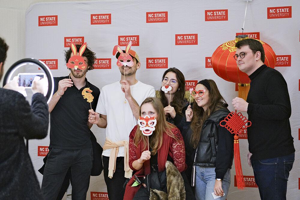 Students take a photo in the photo booth during the Lunar New Year celebration in Talley Student Union on Wednesday, Jan. 25, 2023. Students celebrated the event by engaging in numerous Asian activities.