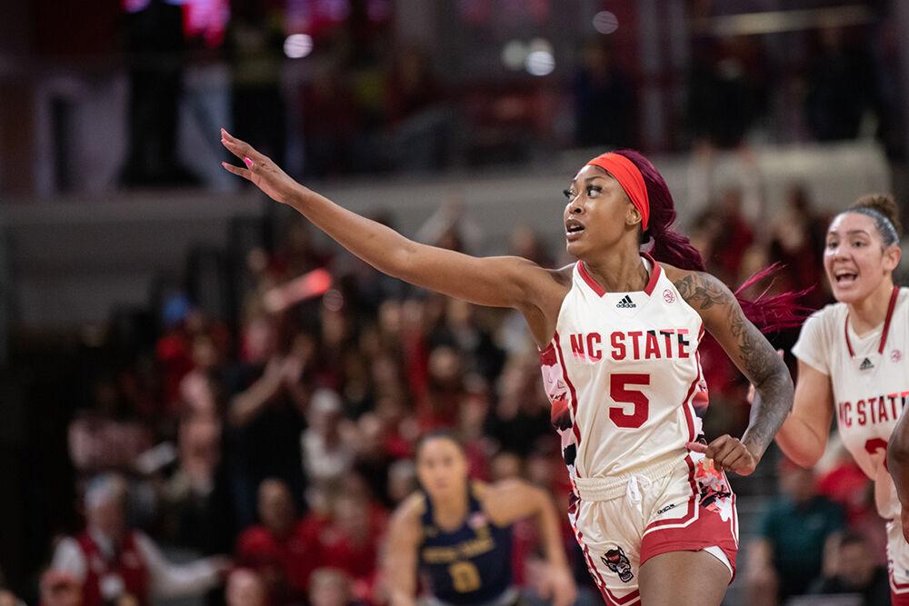 Senior forward Jada Boyd motions to the crowd after scoring during the game versus Notre Dame at Reynolds Coliseum on Sunday, Jan. 29, 2023. Boyd made three field goals and five rebounds. The Wolfpack beat the Fighting Irish 65-69.