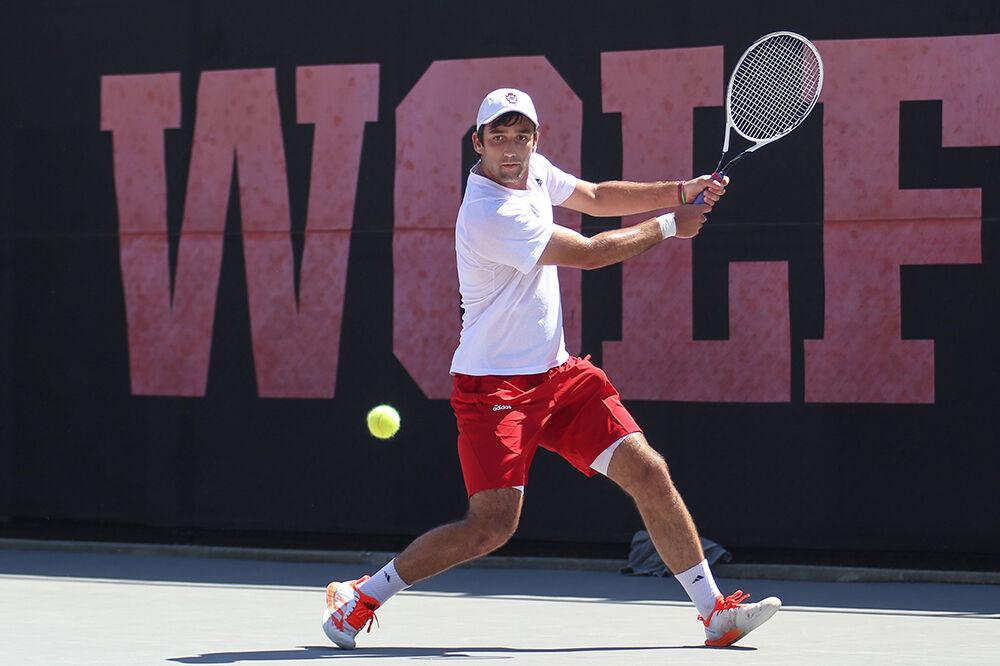 Senior Rafa Izquierdo Luque prepares to backhand the ball during his singles match against UNC-Chapel Hill on Sunday, April 17, 2022 at J.W. Isenhour Tennis Center. The Wolfpack lost to the Tarheels 4-3.