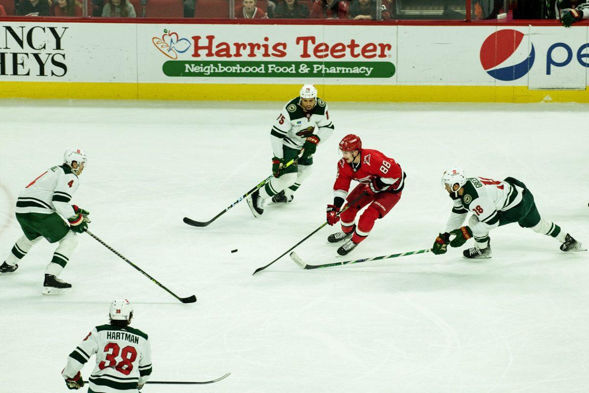 Left-Winger Yuevo Teravainen fights for control of puck during the gave versus Minnesota at PNC Arena on Thursday, Jan. 19, 2023. Teravainen scored one goal. The Hurricanes beat the Wile 5-2.